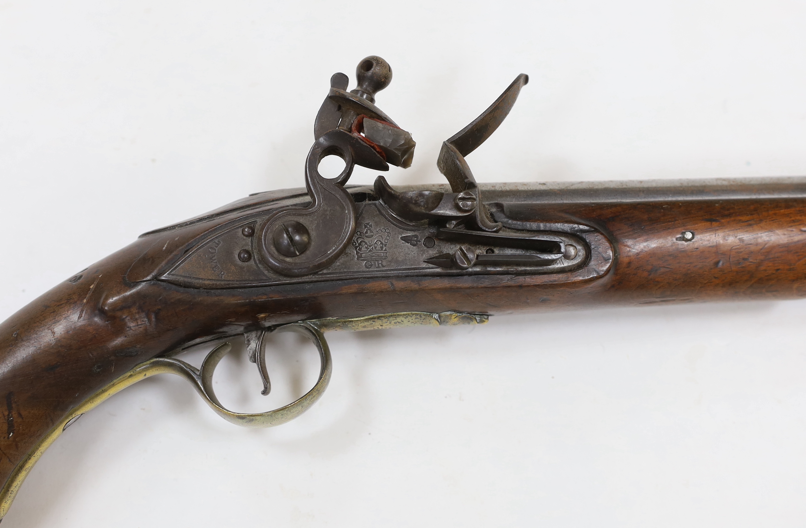 An early 19th century flintlock pistol, fully stocked with Tower proofs and crown over GR stamp to lock, plain brass butt cap and trigger guard